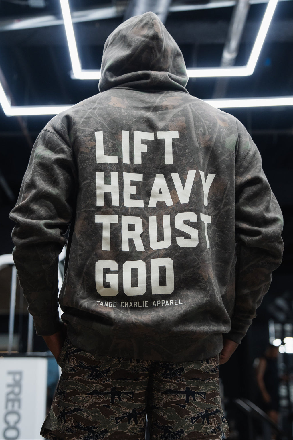 Lift Heavy. Trust God. - Premium Darkwood Camo Hoodie